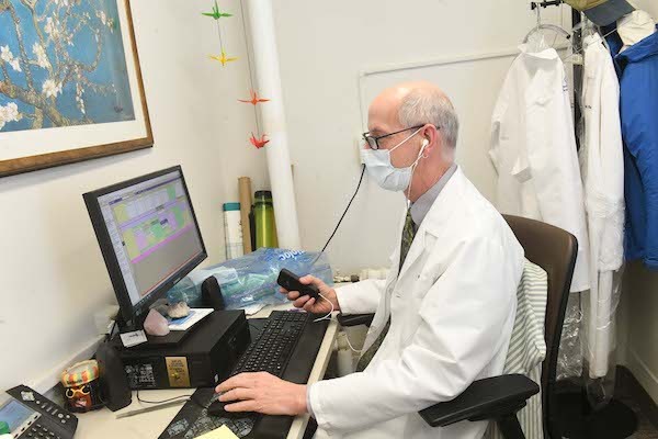 Medical Services physician preparing for a virtual appointment with a student